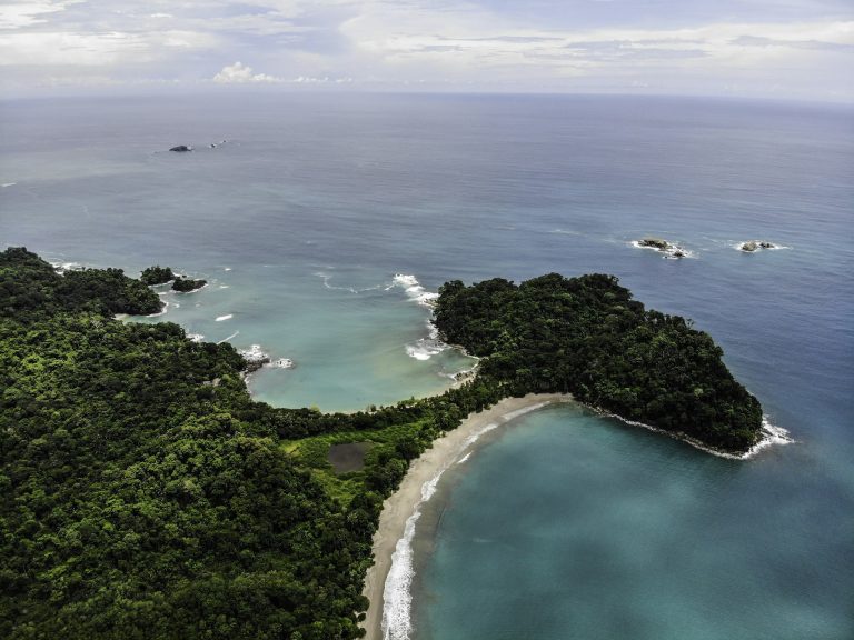 Why US and European Investors Cannot Find Costa Rican Hotels the Way They Search at Home Aerial view of a forested Costa Rican coastline and cove